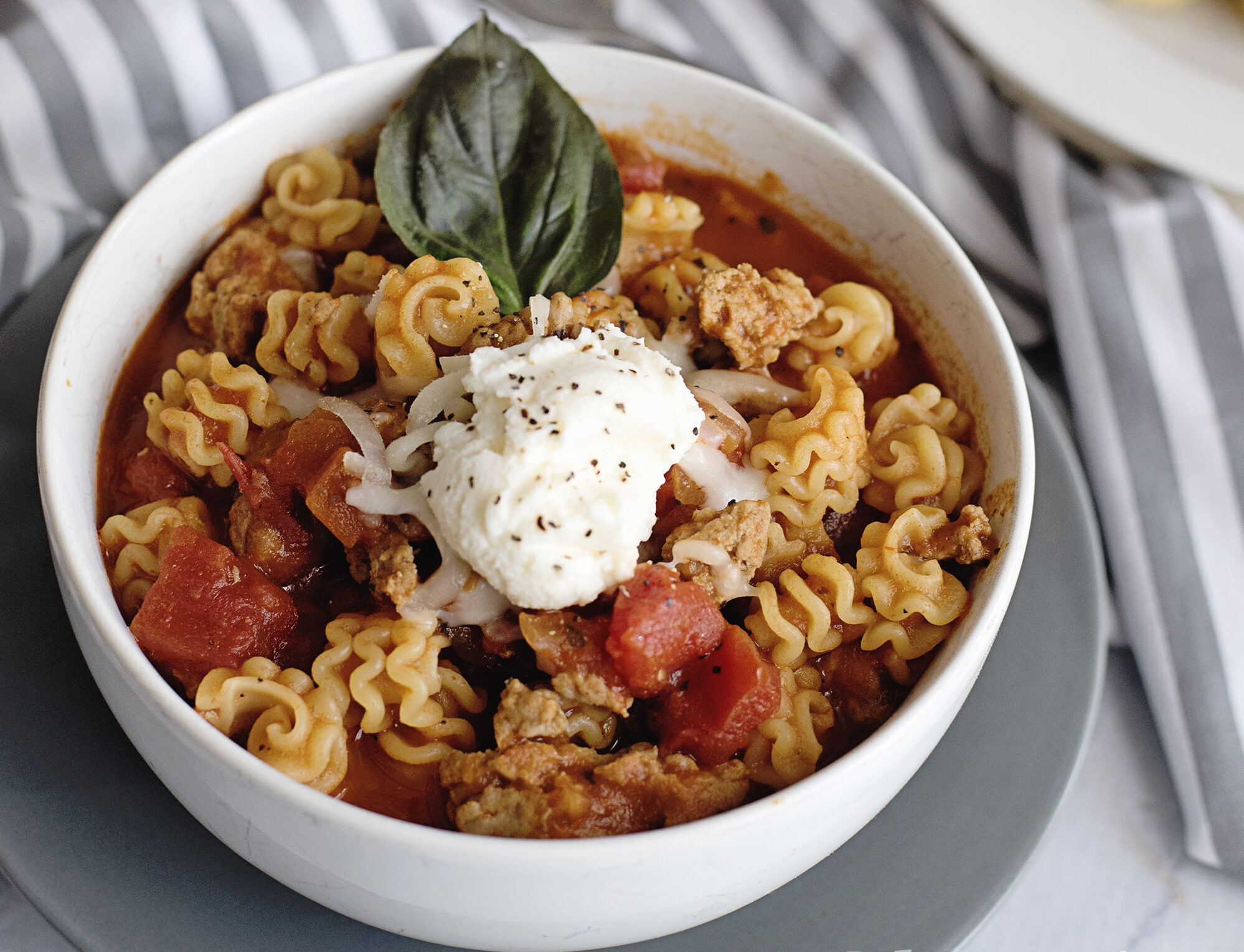 Quick family dinner idea: pasta with marinara and melted cheese